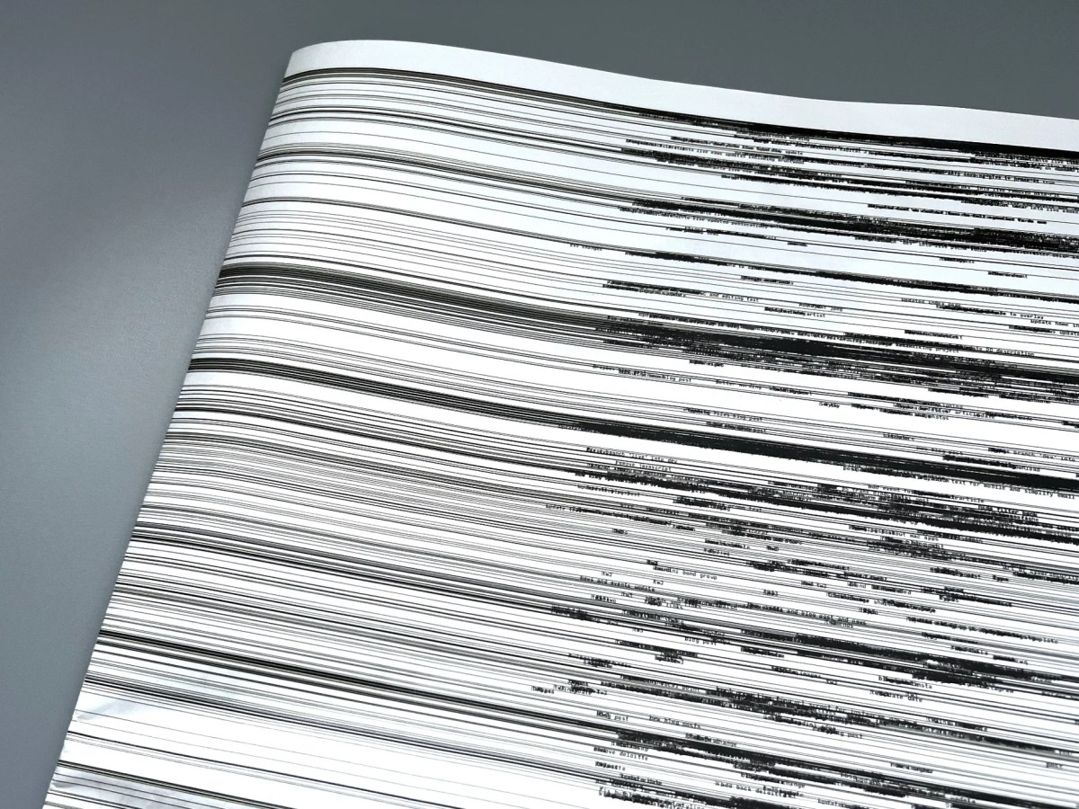 A signed haiku broadsheet titled "Brendan Dawes – Now Becomes Then" features a close-up of black horizontal lines of varied thickness and density, recalling Dawes's artwork, displayed on a gray surface.