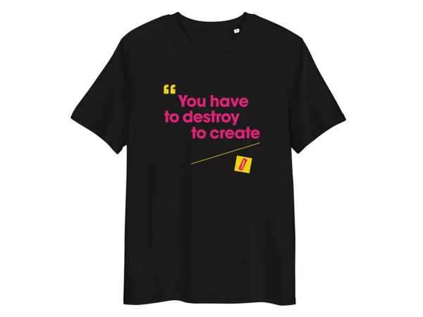 The "You Have To Destroy To Create - Black T-Shirt" features bold pink and yellow text with a yellow quotation mark and a small yellow eraser graphic, making a striking punk statement.