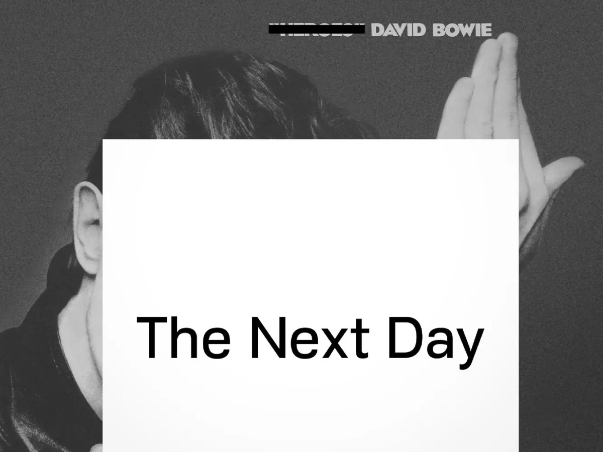 Original flyposter for David Bowie’s "The Next Day," signed. Features a black and white design with "The Next Day" in bold text on a white square over Bowie’s "Heroes" photo; DAVID BOWIE appears at top right, original text crossed out.