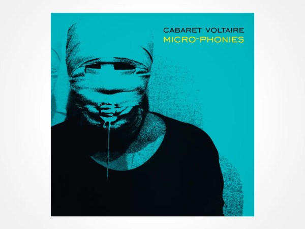 A person with their head wrapped in cloth, covering their face, with only their mouth showing and liquid dripping from it. The image is tinted blue. Text in the corner reads: CABARET VOLTAIRE MICRO-PHONIES.