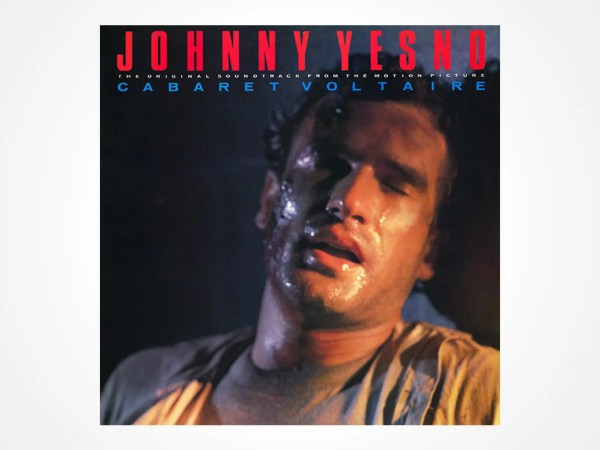 Album cover for Johnny YesNo by Cabaret Voltaire, showing a sweaty man with closed eyes and an intense expression. The title appears in bold red text at the top, with artist and subtitle in smaller letters beneath.