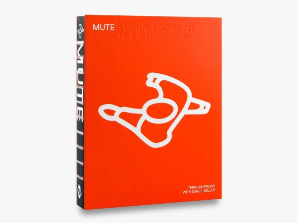 A bright red book titled Mute: A Visual Document from 1978 – Tomorrow with a large white abstract graphic on the cover, created by Terry Burrows with Daniel Miller, shown standing upright against a plain background.