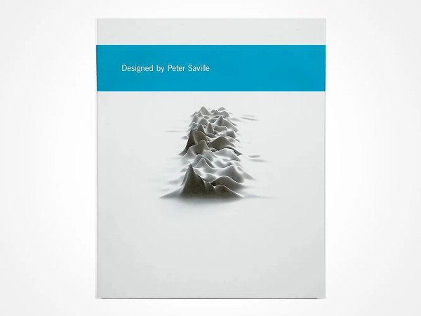 A square book cover with a white background. The center features a grayscale, 3D waveform pattern. A blue band at the top reads “Designed by Peter Saville” in white text.