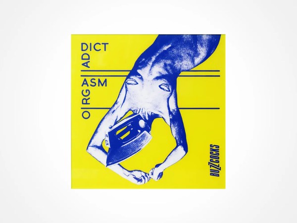 A bright yellow album cover featuring a blue-tinted, upside-down, topless person wearing a helmet. Vertical and horizontal text reads ORGASM ADDICT and BUZZCOCKS in bold letters.